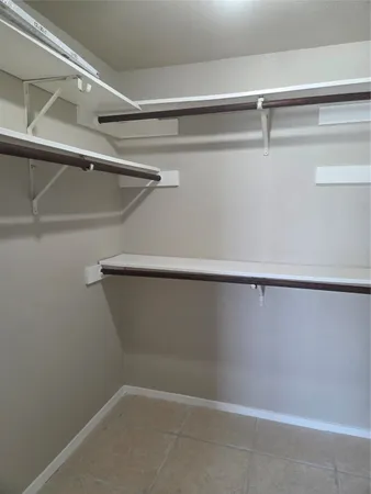 a view of a room with racks on the wall