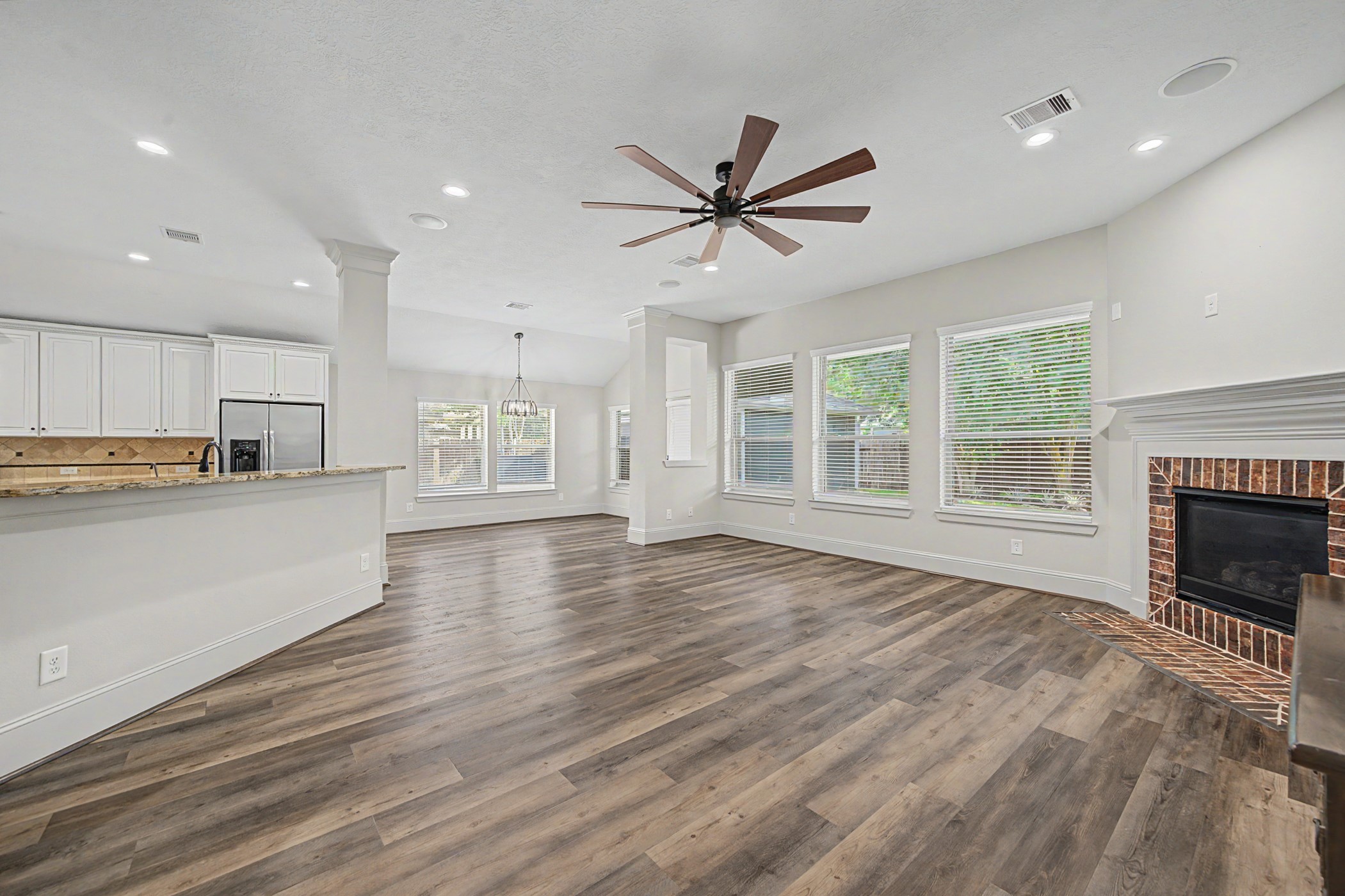 31032 Sunfall Trail Lane Spring, TX 77386 - Photo 10 of 39 a view of an empty room with a kitchen and a window
