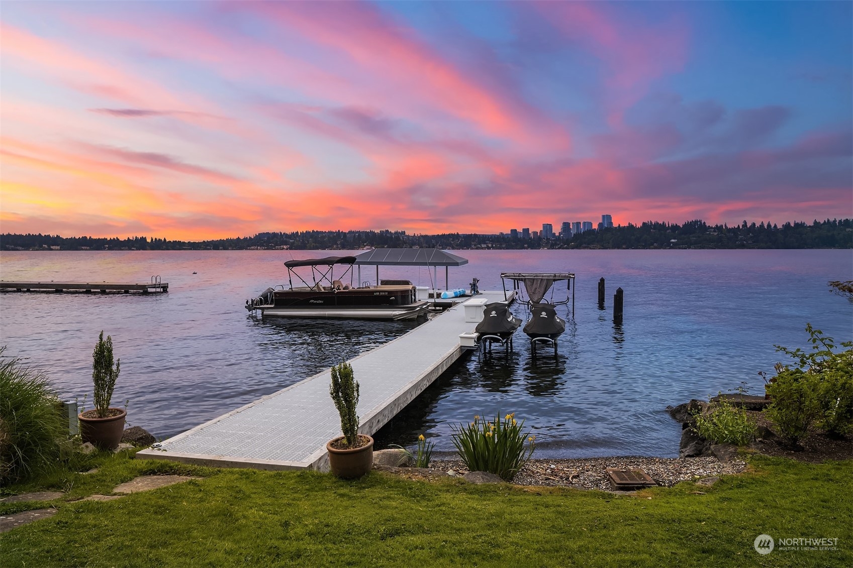7270 North Mercer Way Mercer Island, WA 98040 - Photo 2 of 40 a view of a lake with a yard