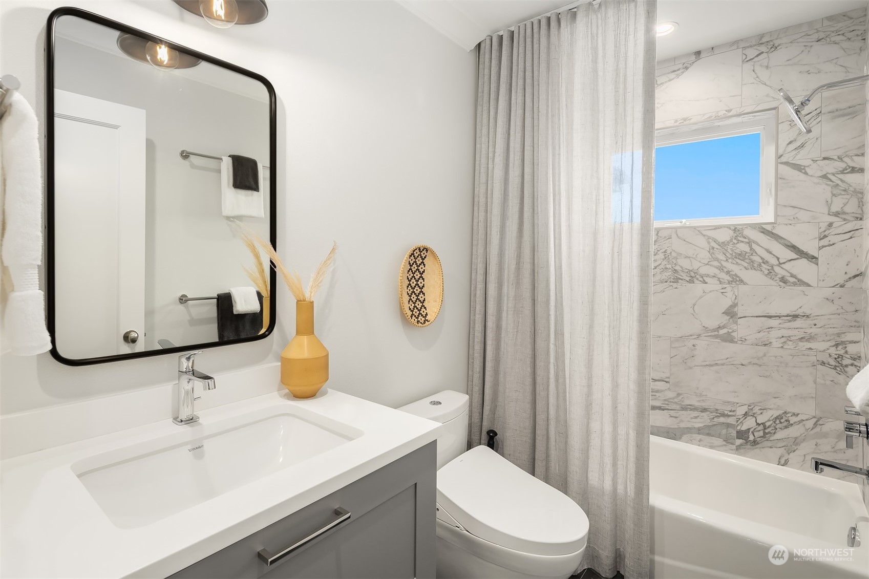 7270 North Mercer Way Mercer Island, WA 98040 - Photo 29 of 40 a bathroom with a sink toilet and shower