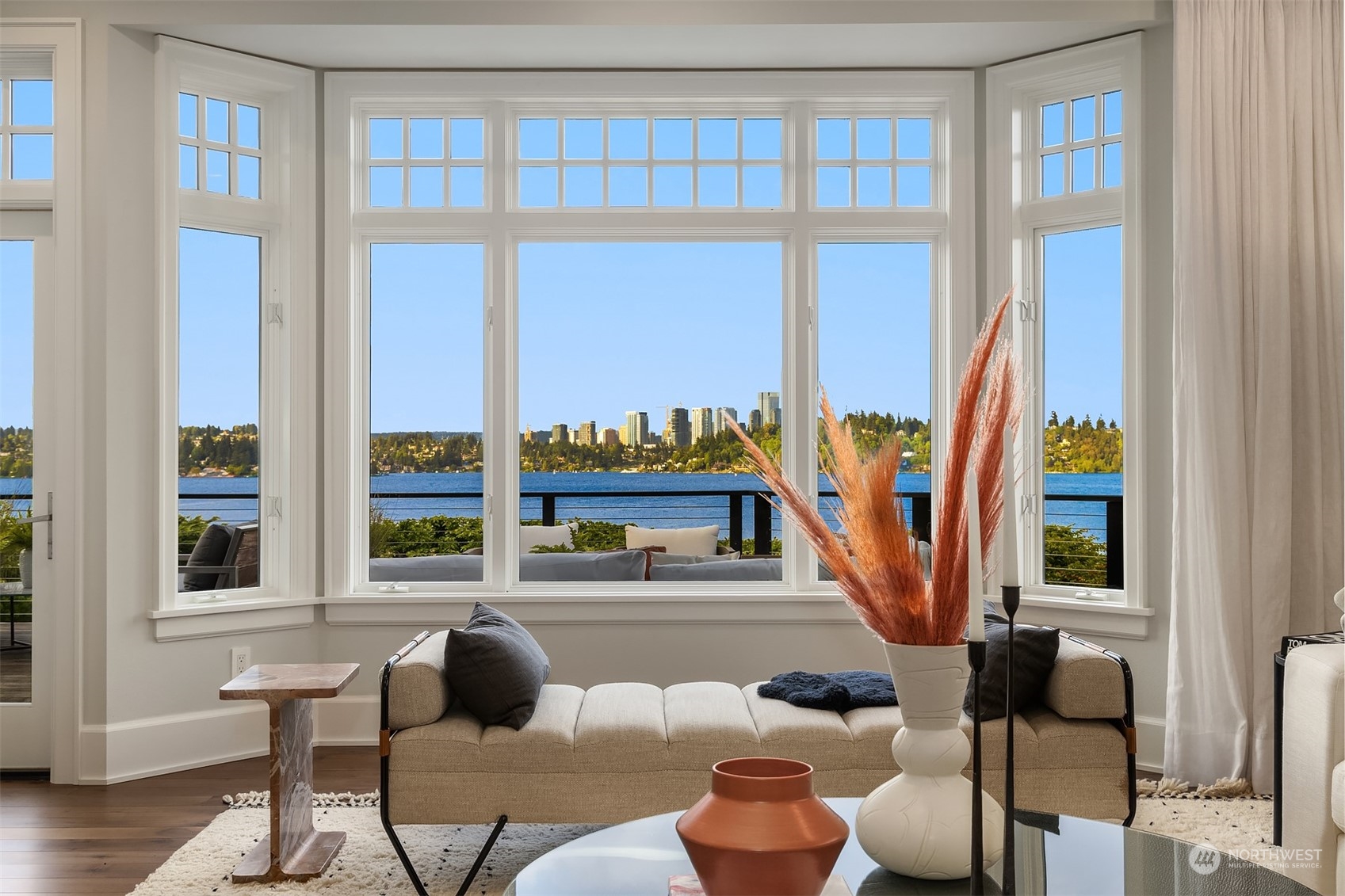 7270 North Mercer Way Mercer Island, WA 98040 - Photo 8 of 40 a living room with furniture and a floor to ceiling window