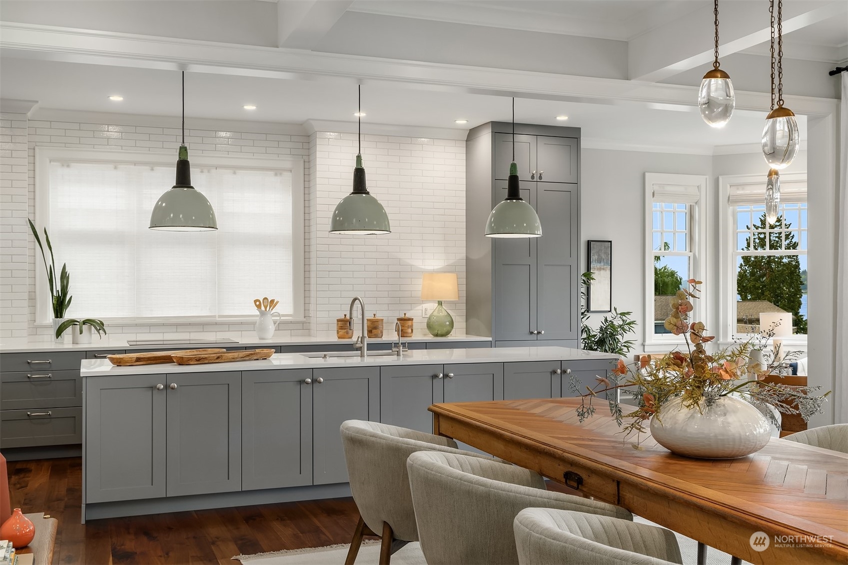 7270 North Mercer Way Mercer Island, WA 98040 - Photo 10 of 40 a kitchen with a sink a stove and chairs