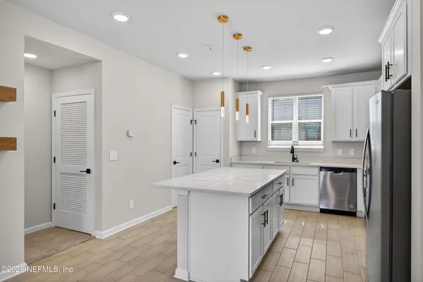 a bathroom with a sink toilet a mirror and shower