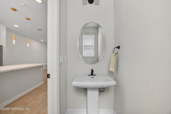 an empty room with a ceiling fan and carpet