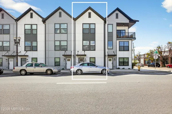 wooden floor in an empty room with a ceiling fan