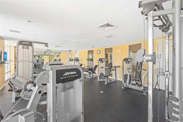 a view of a livingroom with furniture and a flat screen tv