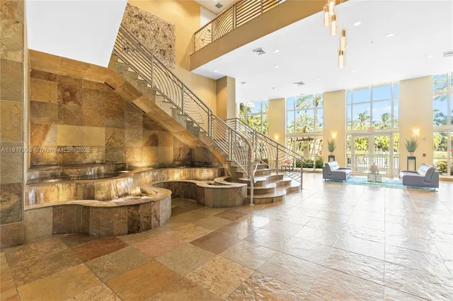 a living room with couches and pool view