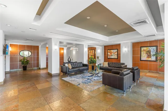 a living room with furniture a window and a fireplace