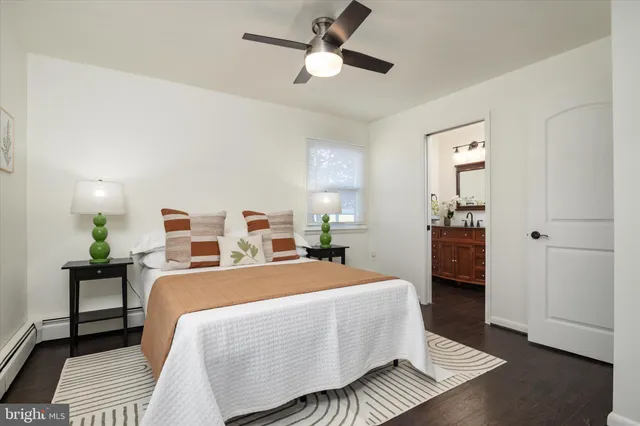 a room with a bed and a chandelier