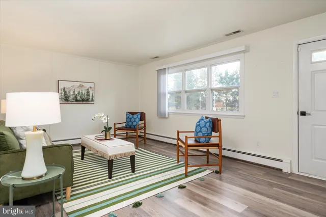 a living room with furniture and a window