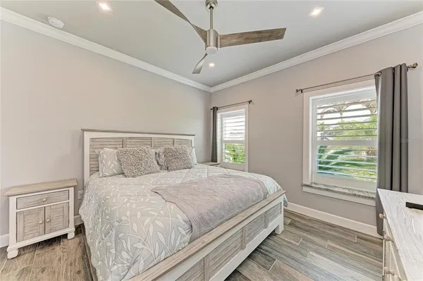 a bedroom with a large bed and a window