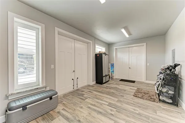a view of a bedroom with a large bed and large windows
