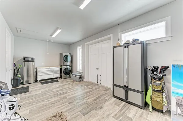 a view of a livingroom with furniture and a window