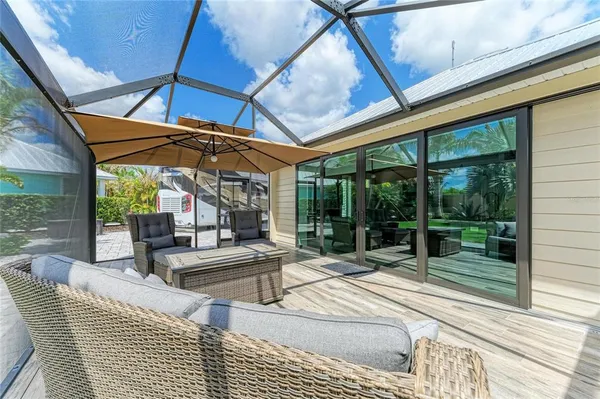 a building outdoor space with patio furniture and potted plants