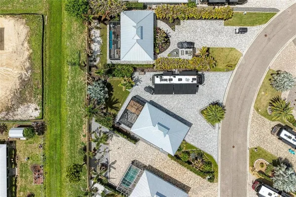 an aerial view of residential house with outdoor space and swimming pool