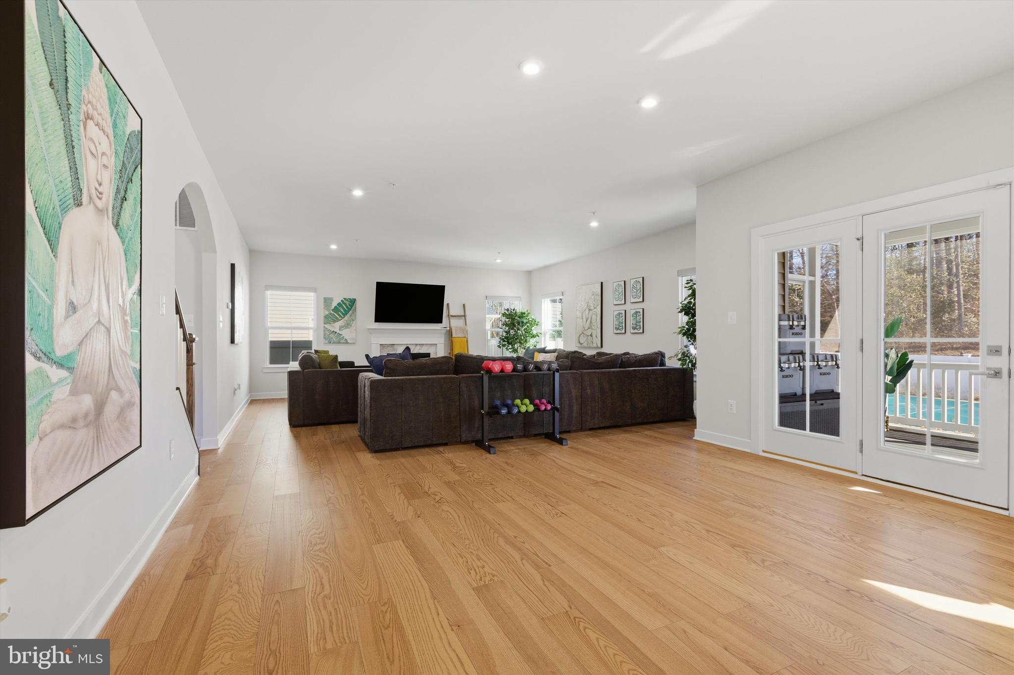 1321 Upper Patuxent Ridge Road Odenton, MD 21113 - Photo 12 of 82 a large room with furniture wooden floor and windows