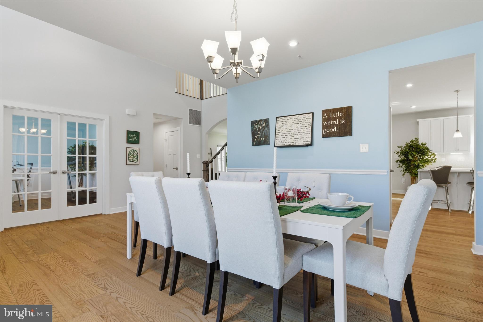 1321 Upper Patuxent Ridge Road Odenton, MD 21113 - Photo 15 of 82 a view of a dining room with furniture and wooden floor
