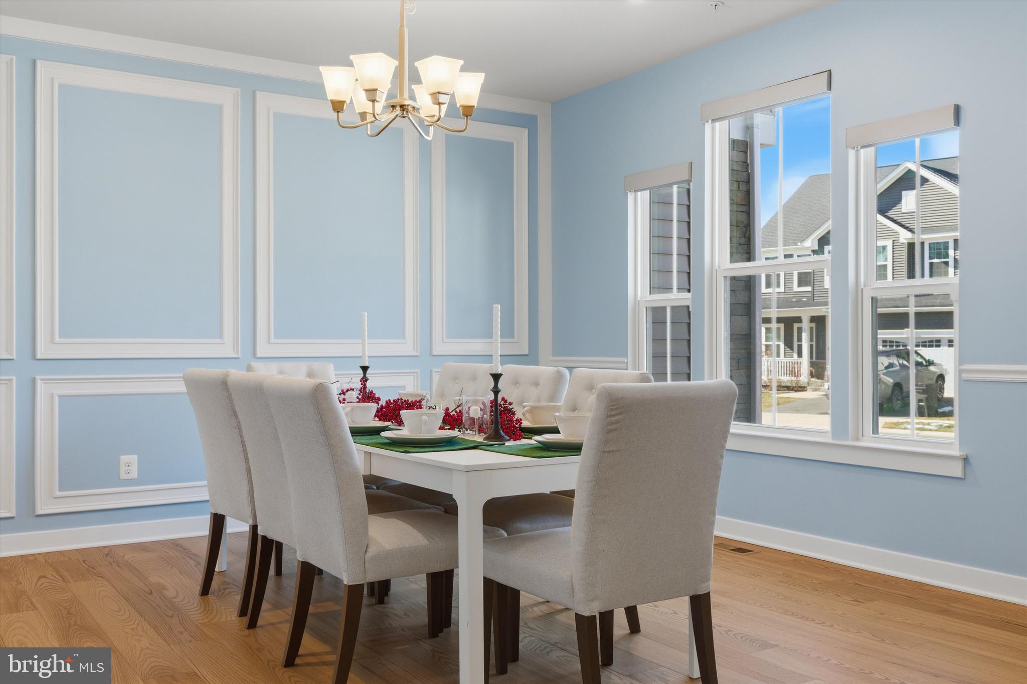 1321 Upper Patuxent Ridge Road Odenton, MD 21113 - Photo 17 of 82 a dining room with furniture a chandelier and wooden floor
