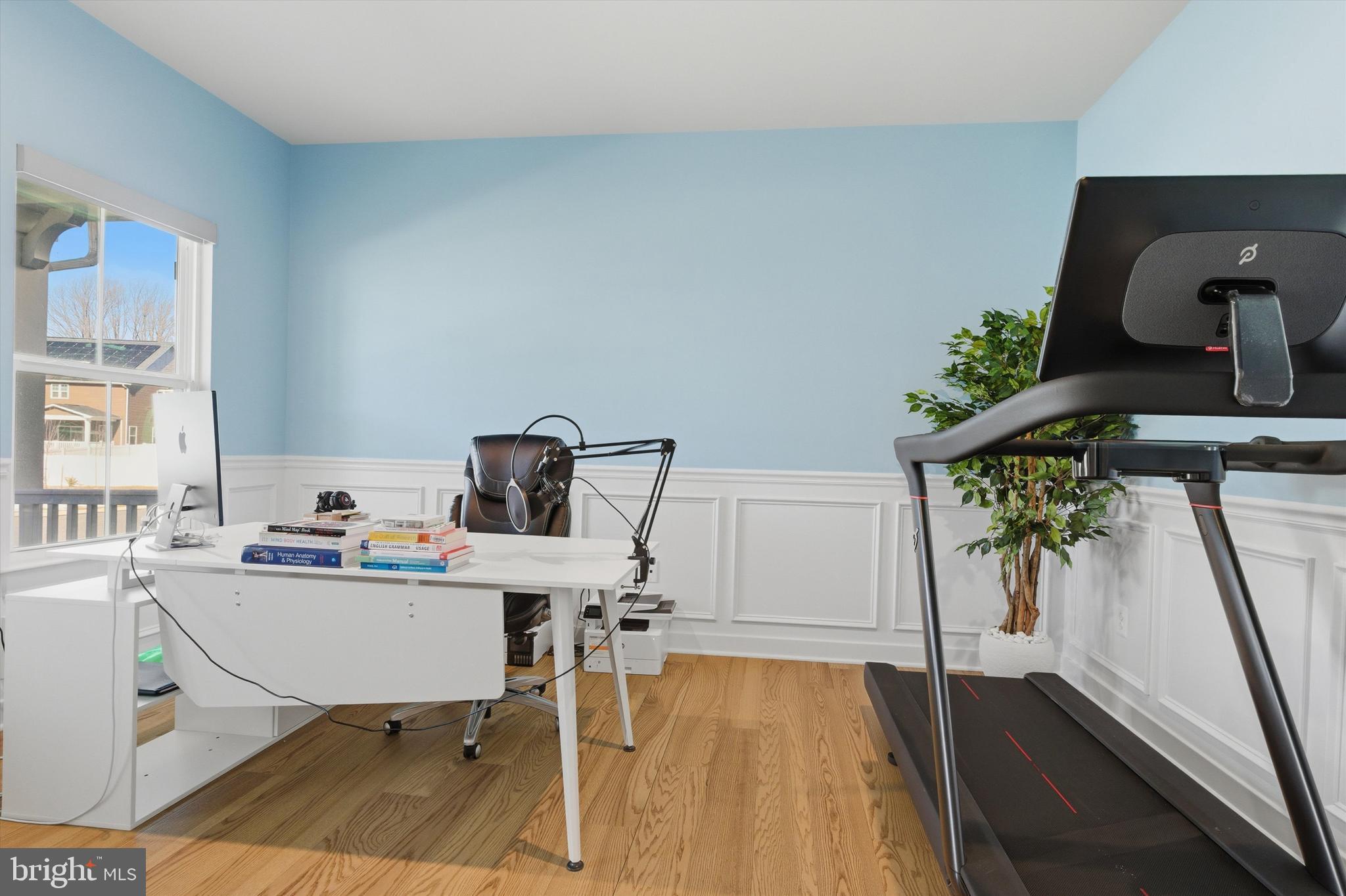 1321 Upper Patuxent Ridge Road Odenton, MD 21113 - Photo 18 of 82 a view of a workspace with furniture and wooden floor