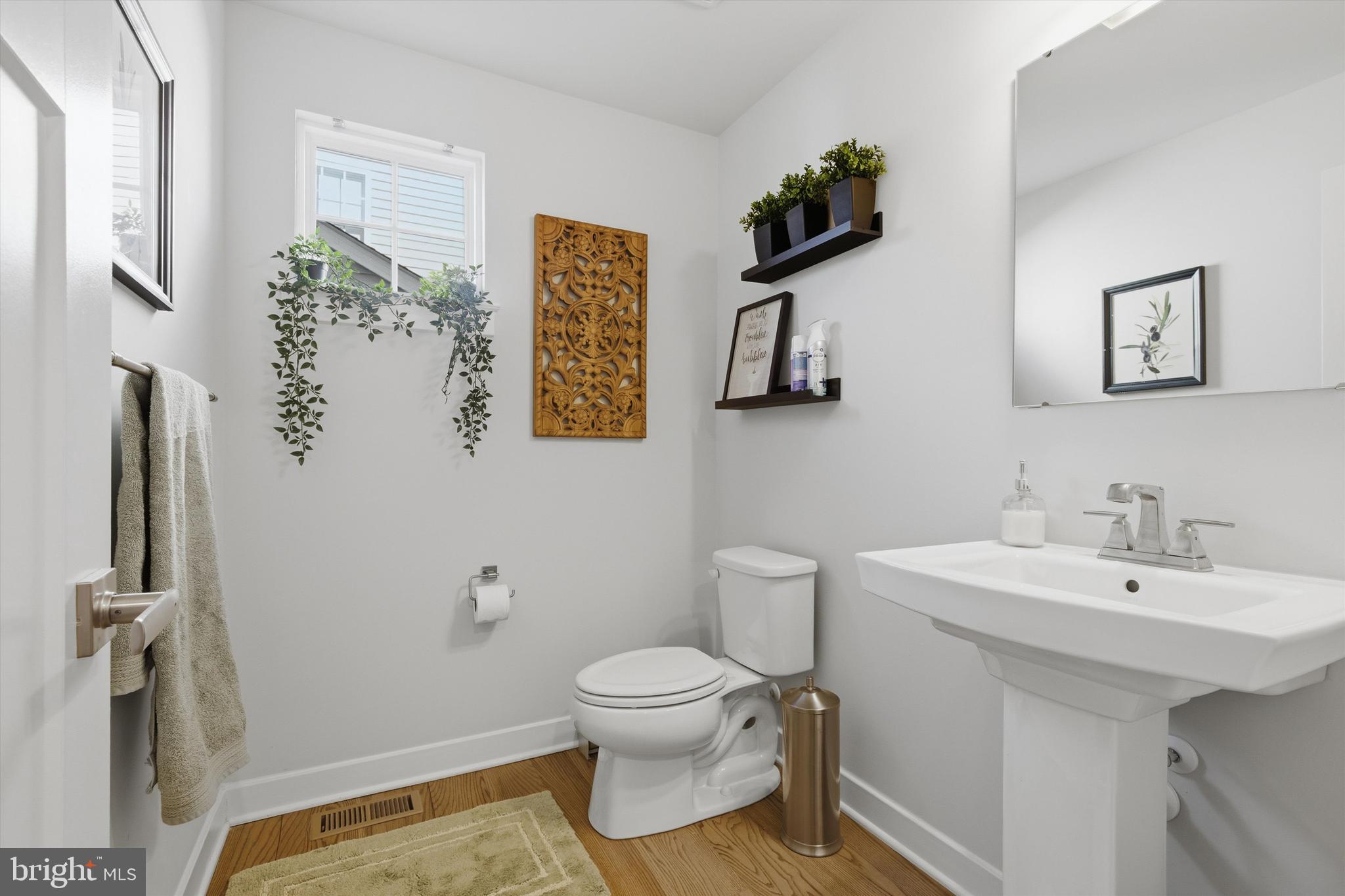 1321 Upper Patuxent Ridge Road Odenton, MD 21113 - Photo 19 of 82 a bathroom with a toilet sink and mirror