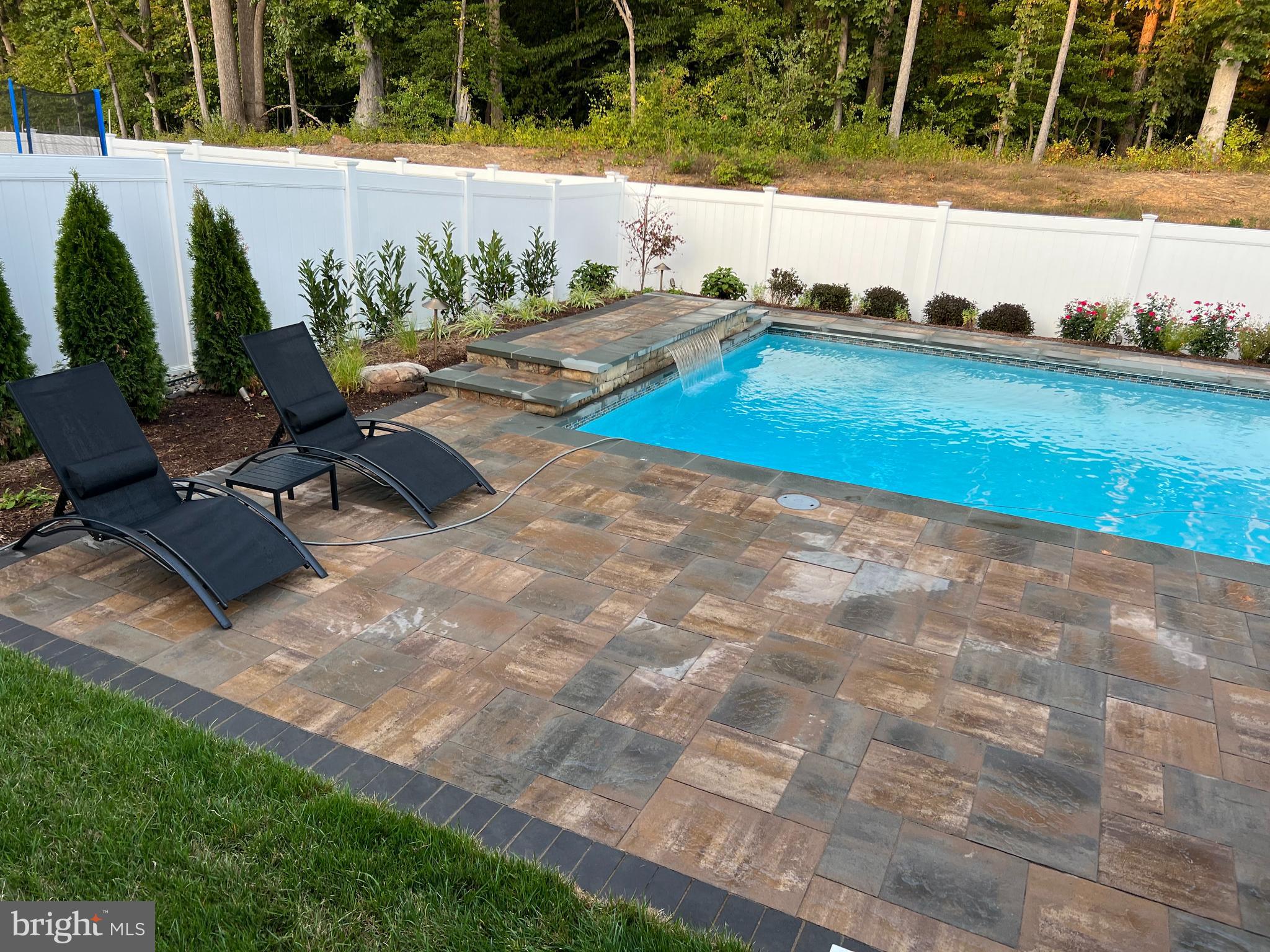1321 Upper Patuxent Ridge Road Odenton, MD 21113 - Photo 2 of 82 a view of swimming pool with a yard and outdoor seating