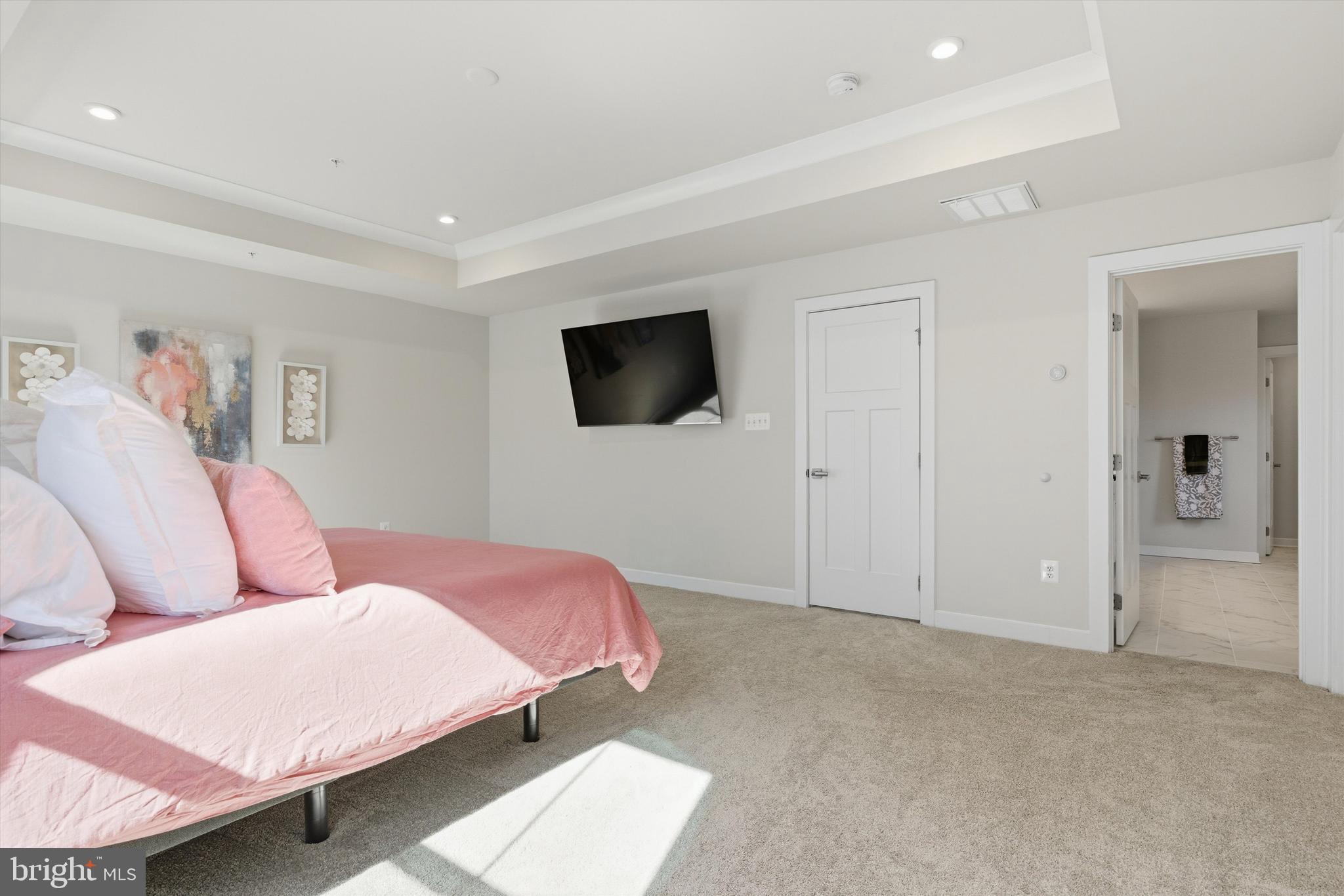 1321 Upper Patuxent Ridge Road Odenton, MD 21113 - Photo 21 of 82 a spacious bedroom with a bed and a flat screen tv