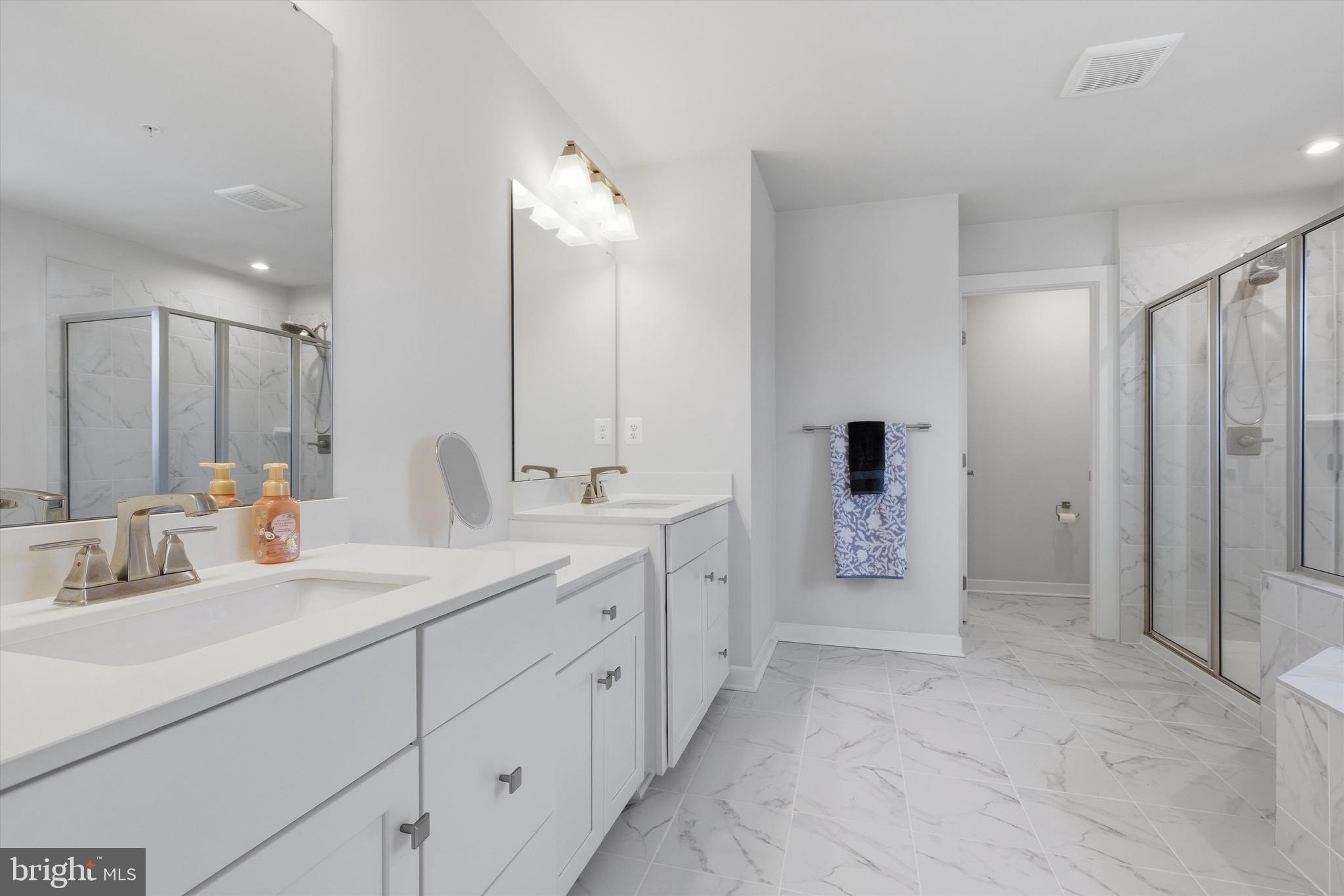 1321 Upper Patuxent Ridge Road Odenton, MD 21113 - Photo 22 of 82 a spacious bathroom with a double vanity sink mirror and double