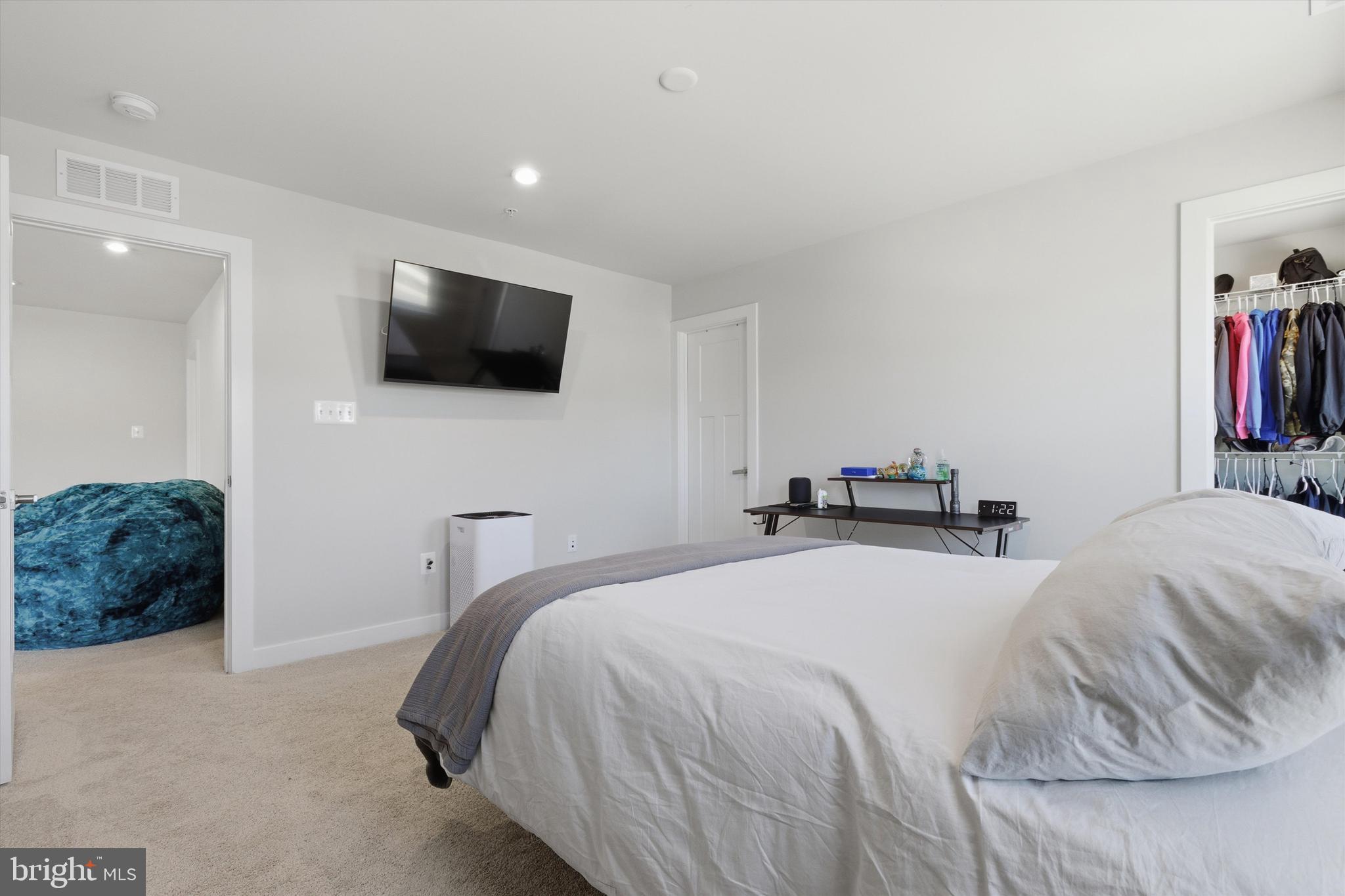 1321 Upper Patuxent Ridge Road Odenton, MD 21113 - Photo 25 of 82 a bedroom with a bed and a flat screen tv
