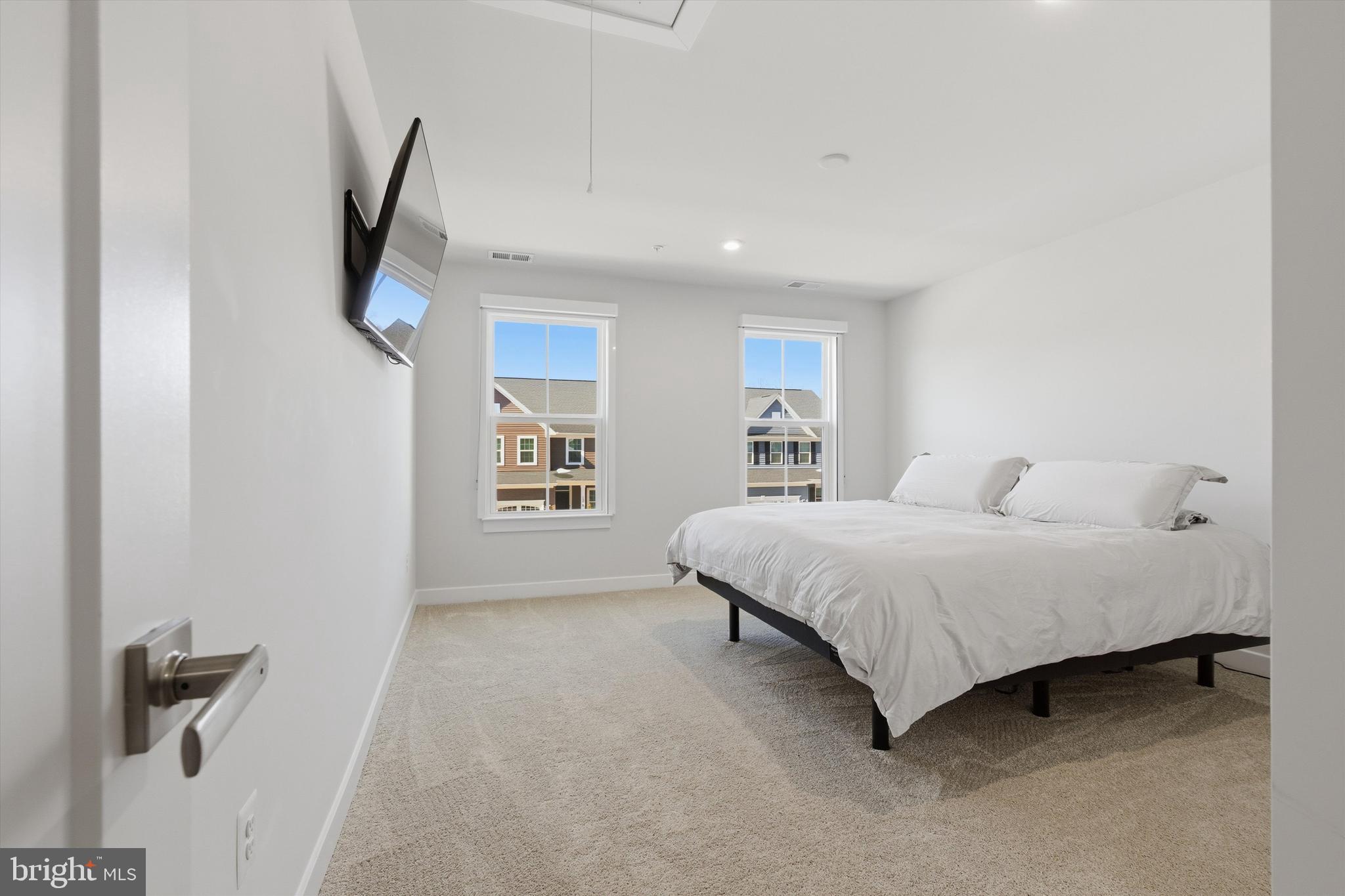 1321 Upper Patuxent Ridge Road Odenton, MD 21113 - Photo 27 of 82 a spacious bedroom with a bed and a walk in closet