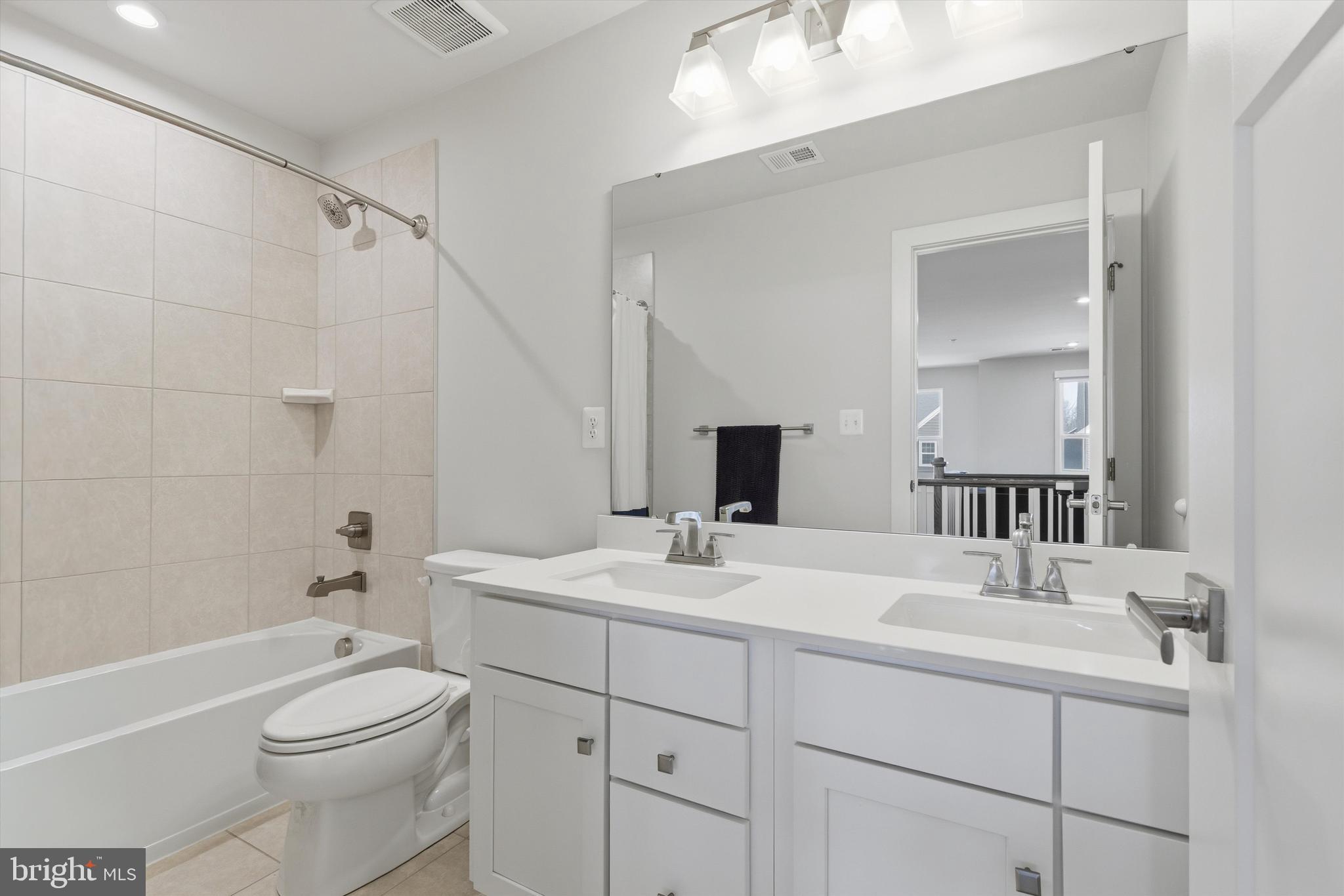 1321 Upper Patuxent Ridge Road Odenton, MD 21113 - Photo 31 of 82 a bathroom with a sink a toilet and shower
