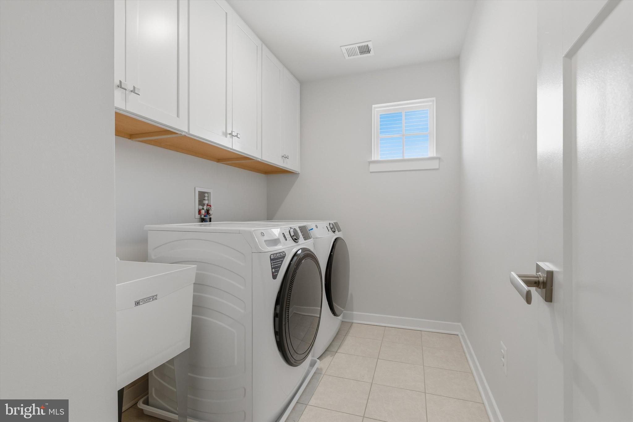 1321 Upper Patuxent Ridge Road Odenton, MD 21113 - Photo 34 of 82 a utility room with dryer and washer