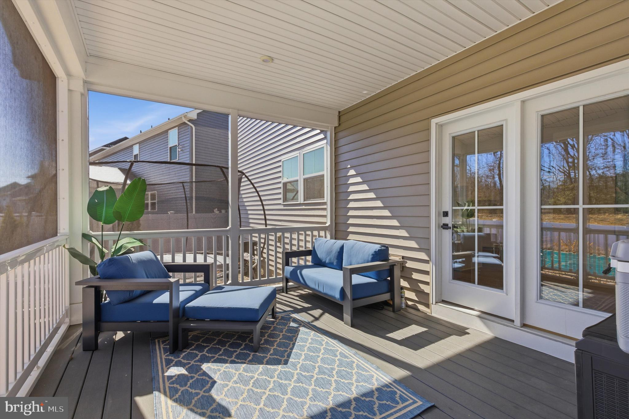 1321 Upper Patuxent Ridge Road Odenton, MD 21113 - Photo 39 of 82 a outdoor living space with furniture and a rug