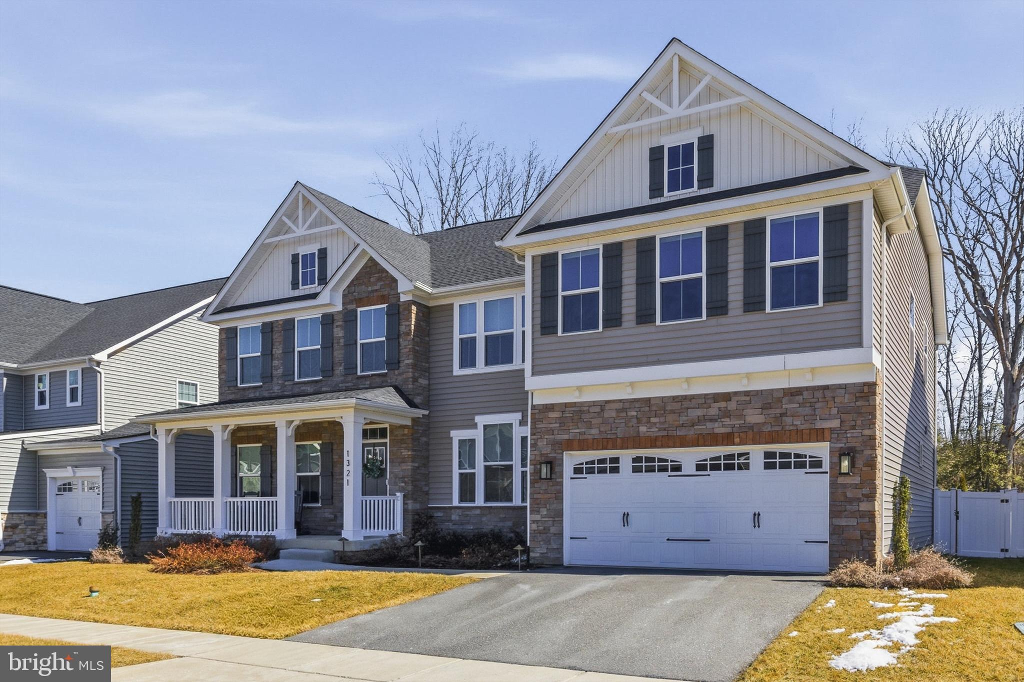 1321 Upper Patuxent Ridge Road Odenton, MD 21113 - Photo 4 of 82 a view of a brick house with a large windows