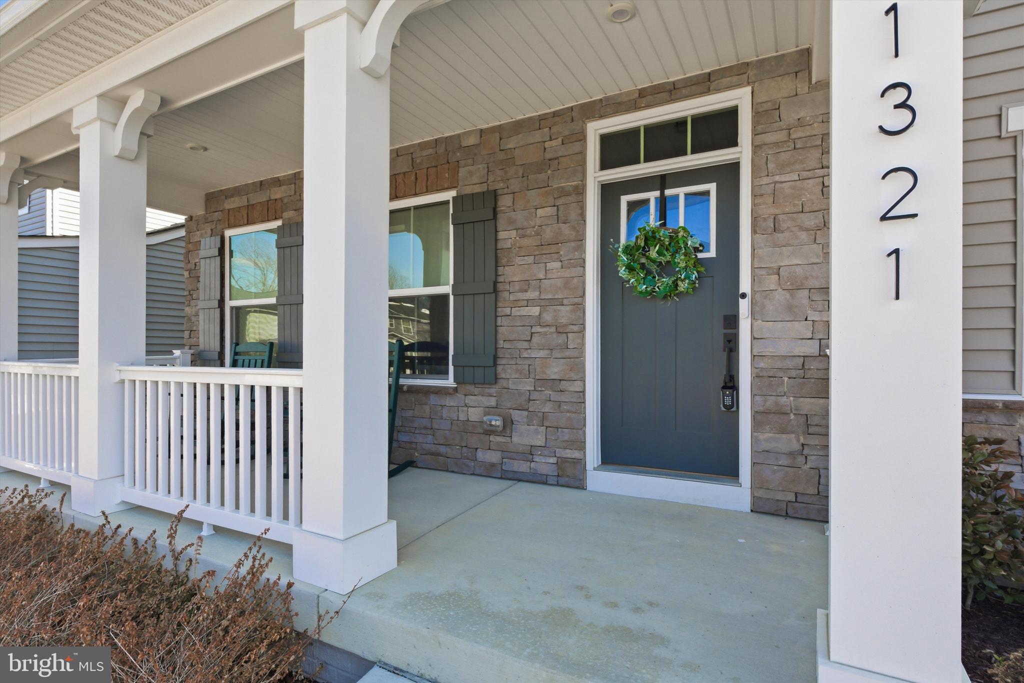 1321 Upper Patuxent Ridge Road Odenton, MD 21113 - Photo 5 of 82 a view of a porch with a bench