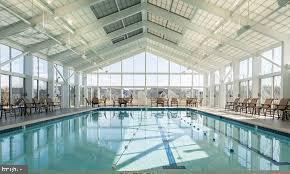 1321 Upper Patuxent Ridge Road Odenton, MD 21113 - Photo 56 of 82 a large white building with swimming pool in front of it