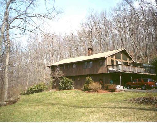 7 Sand Hill Road Newtown, CT 06482 - Photo 1 of 1 a front view of a house with a yard