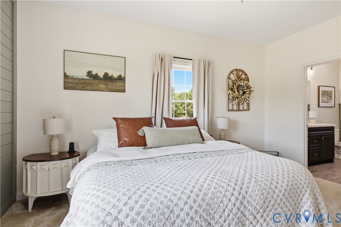 235 Stoney Point Road Cumberland, VA 23040 - Photo 25 of 35 a bedroom with a bed and a lamp on dresser