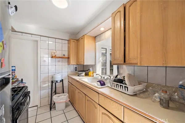 a kitchen with a sink and cabinets