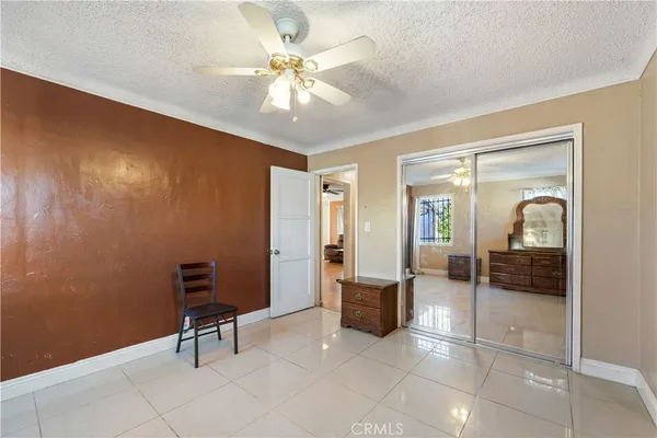 a view of a livingroom with a chair and painted walls