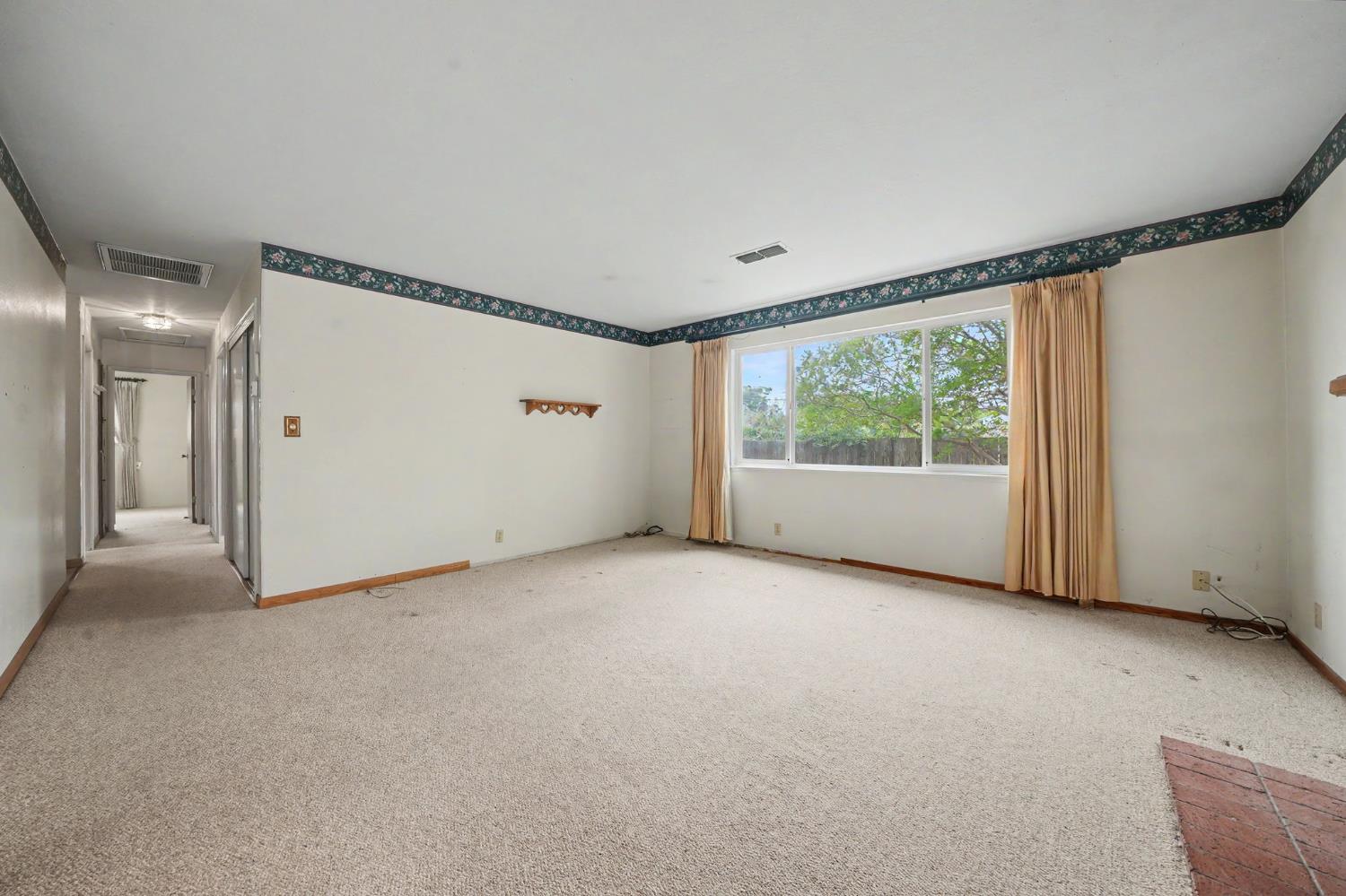 626 Sutter Lane Ione, CA 95640 - Photo 9 of 21 a view of an empty room with a window