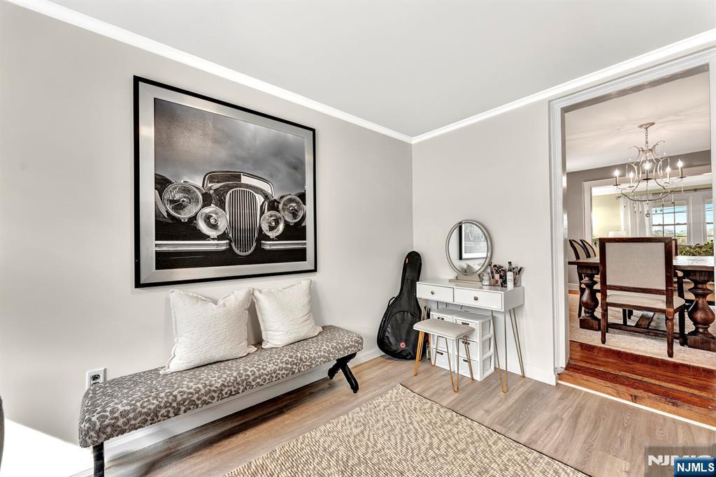 57 Berkeley Avenue Belleville, NJ 07109 - Photo 11 of 36 a living room with furniture and a painting on the wall