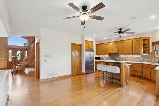 a view of a livingroom with furniture and a kitchen