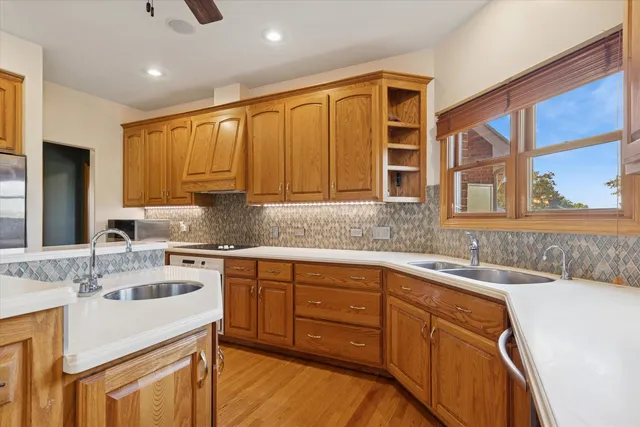 a kitchen with a sink stove and cabinets