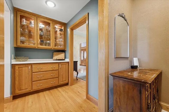 a kitchen with a granite countertop sink and a window