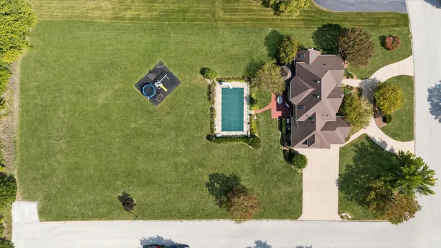 an aerial view of a house with a garden