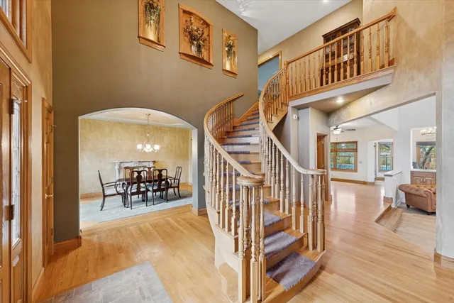 a view of entryway livingroom and hall with wooden floor