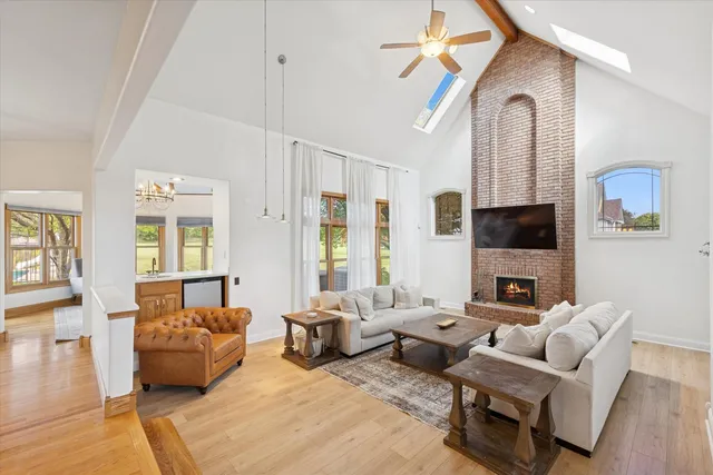 a living room with furniture fireplace and a flat screen tv