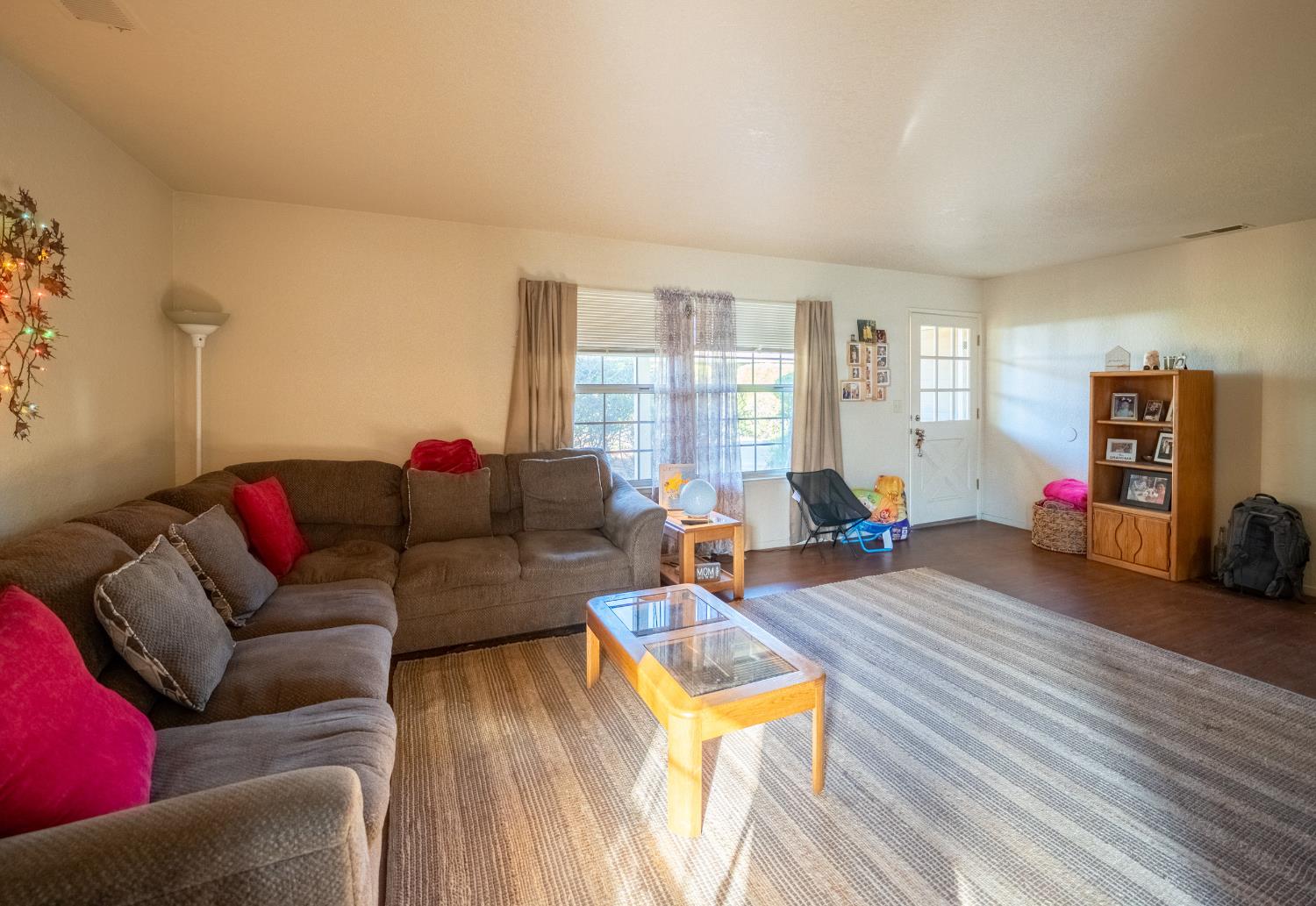 494 Surrey Court Murphys, CA 95247 - Photo 63 of 76 a living room with furniture and a wooden floor