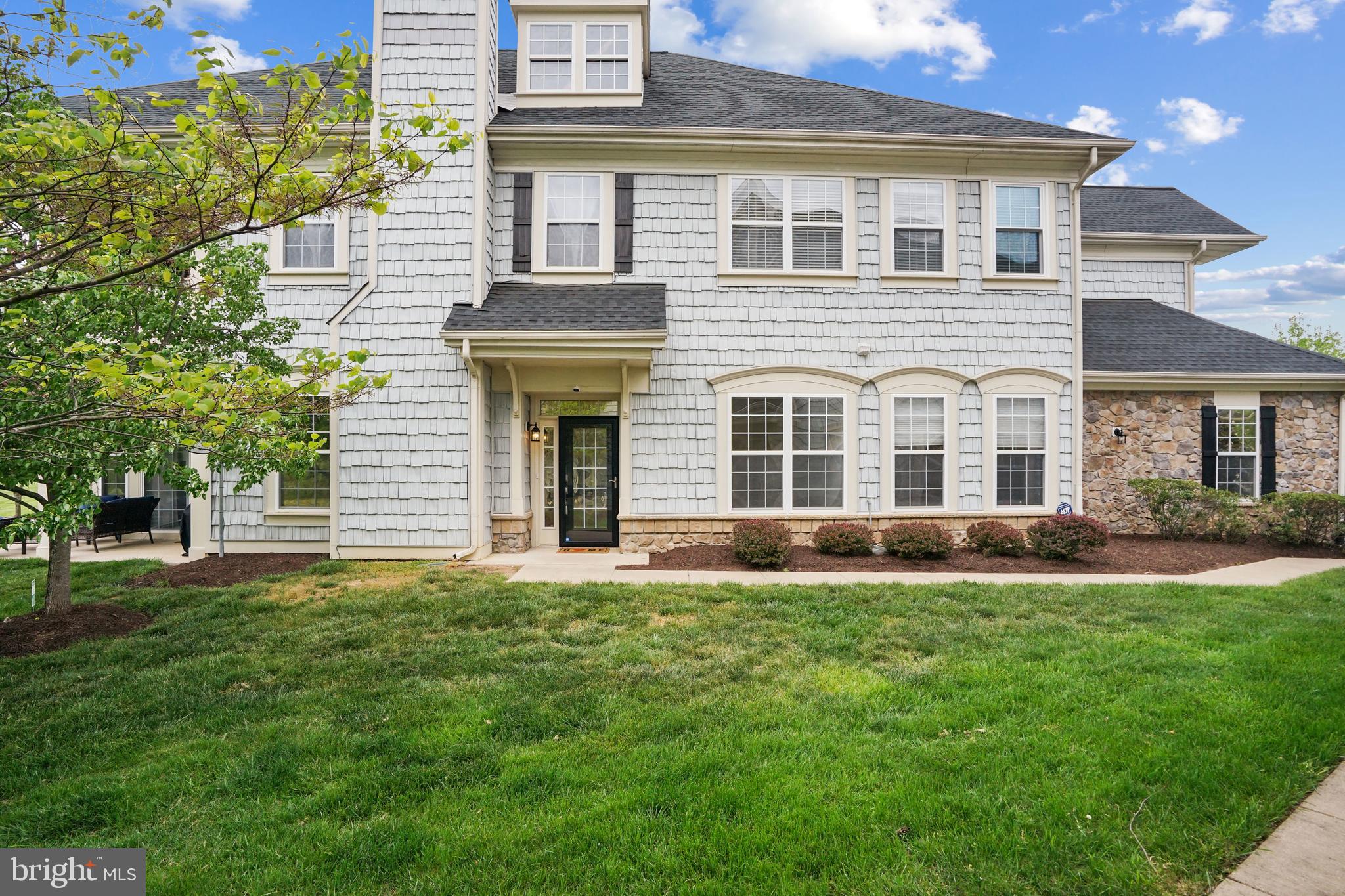 front view of a house with a yard