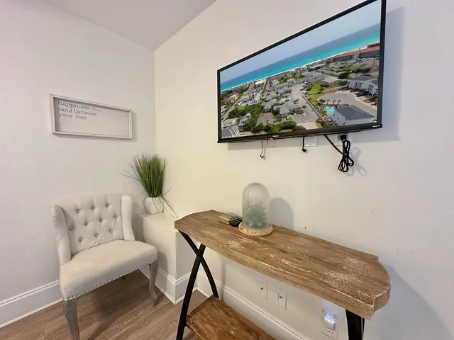 a kitchen with stainless steel appliances granite countertop a white cabinets a sink a stove and a refrigerator